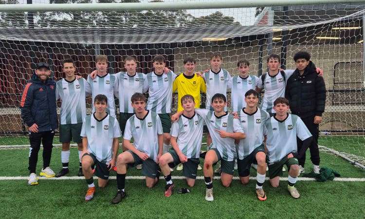 Fifteen of our soccer students in a group after winning this season's premiership. Teacher is standing on the left of the group of students.