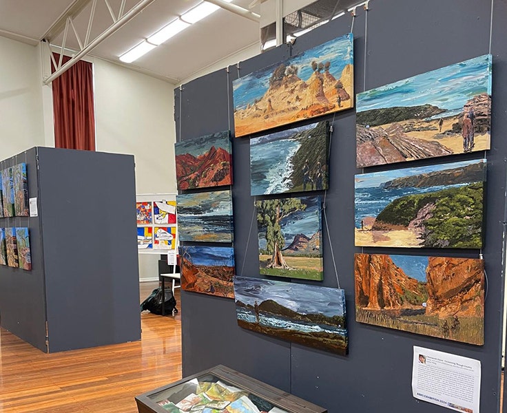 An image of ten canvases as part of one of our HSC Visual Arts student's Major Works on display boards at our CAPA Showcase.