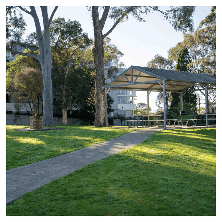 An outdoor photograph of the school's Year 7 area including a sheltered lunch area.