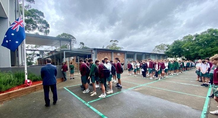Image of our school students gathered outside on the quadrangle as part of our annual ANZAC day ceremony.